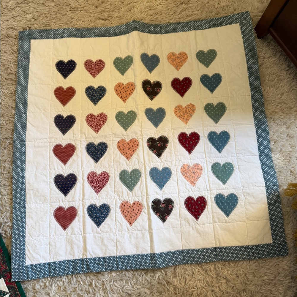 Heart Patterned Quilt with Blue Border